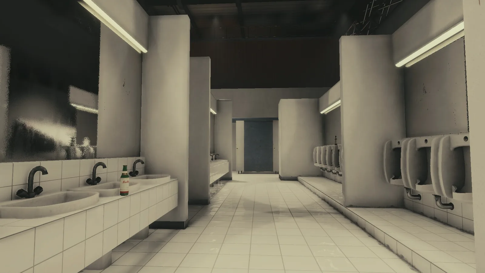 White-tiled bathroom set in BLACKWOOD, with a row of basins, urinals, partitions and strip lights