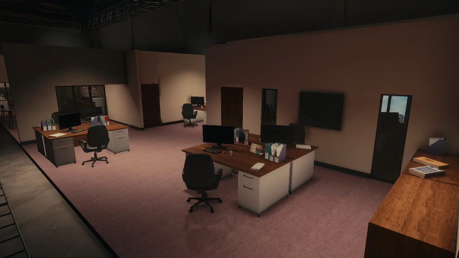 Desks and a manager's office door on the BLACKWOOD office set, with a TV on the wall