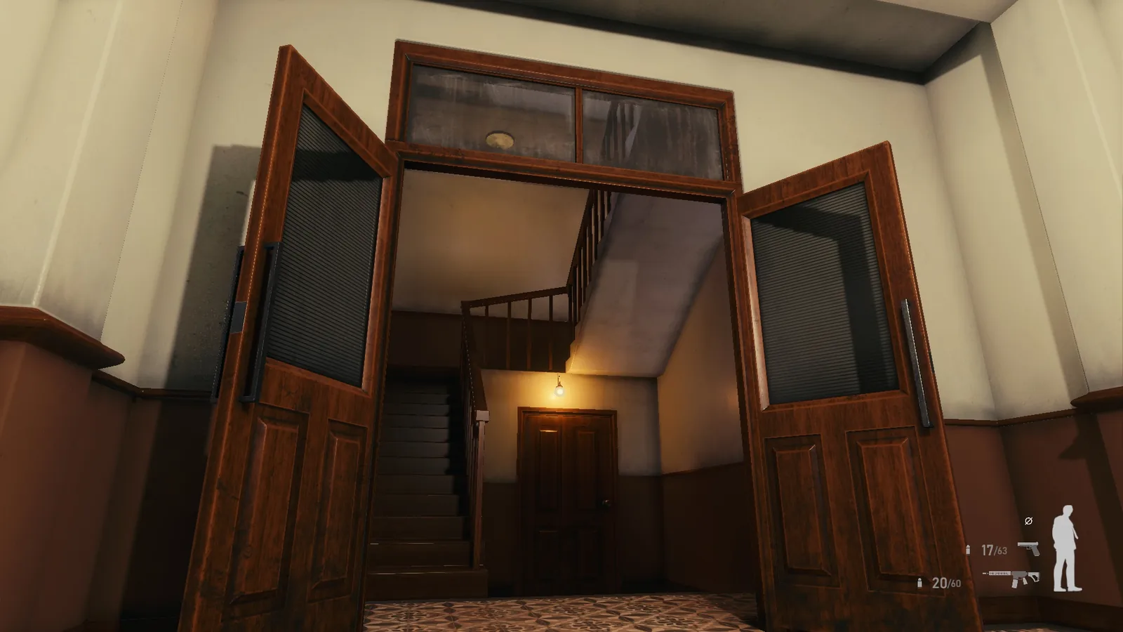 Double wooden doors opening onto a stair hall in the BLACKWOOD office building, with warm wall lights