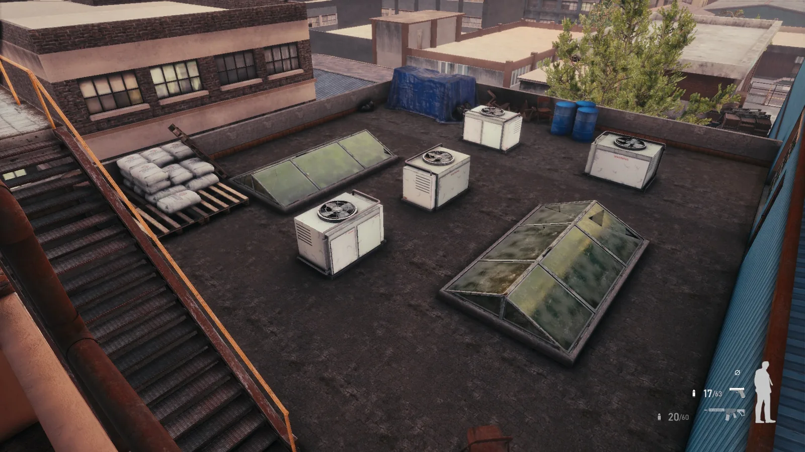 BLACKWOOD rooftop with skylights, air-conditioning units, stacked sandbags and a fire escape stair